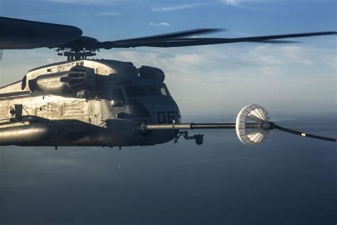 A Ch 53E Super Stallion Helicopter Receives Fuel During An Aerial