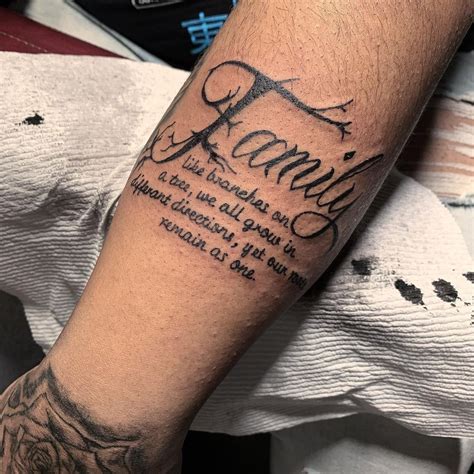 A Man With A Tattoo On His Arm That Says Family And The Words Are