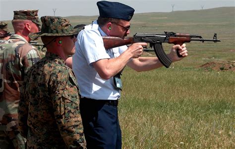 A Marine Corps Noncommissioned Officer Watches As Coast Guard Lt Brad