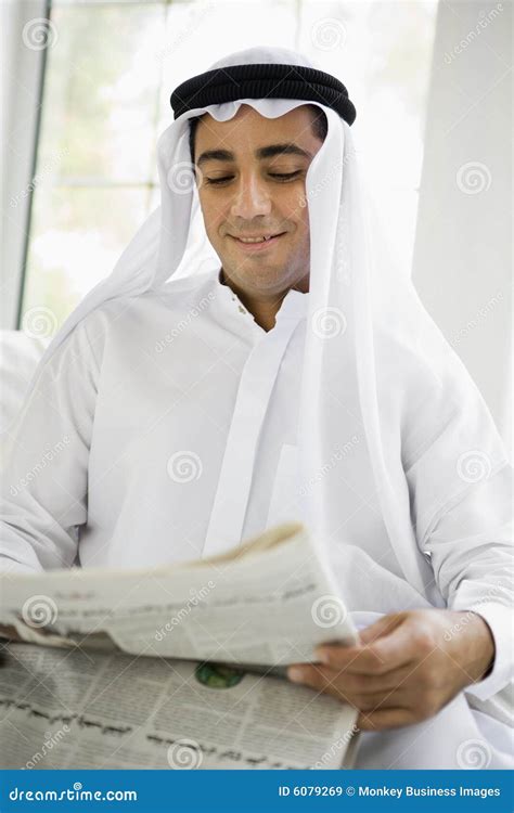 A Middle Eastern Man Reading A Newspaper Stock Image Image Of