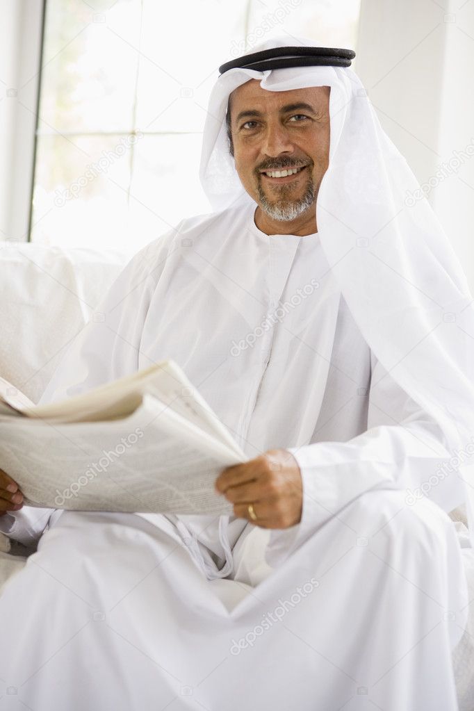 A Middle Eastern Man Reading A Newspaper Stock Photo Image Of Happy