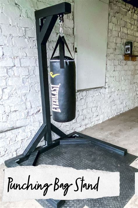 A Punching Bag Stand In Front Of A Brick Wall With The Words Punching