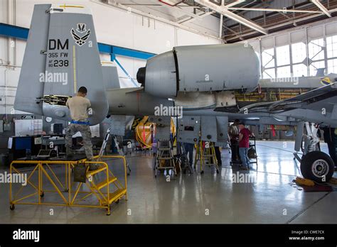 Airmen Perform Maintenance Work On An A 10 Thunderbolt From The 354Th