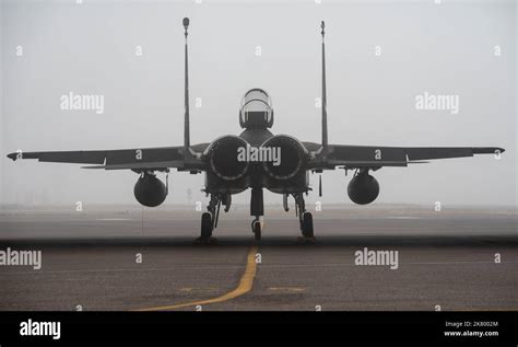 An F 15 From The 142Nd Wing Sits Ready During A Foggy Morning At