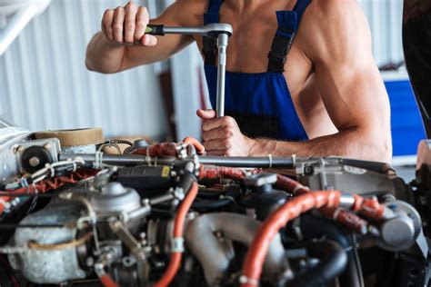 Cropped Image Of A Repair Man Hands Fixing Engine On A Plane Royalty