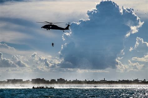 Navy Helicopters And Air Force Pararescue Forces Conduct Astronaut