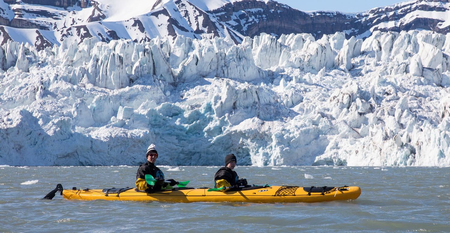 Svalbard Norway Kayaking Tourists Explore The Icy Waters And