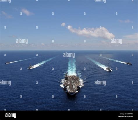 The Aircraft Carrier Uss Abraham Lincoln Leading A Formation Of Ships