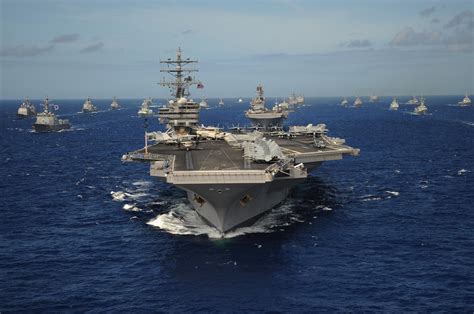 The Nimitz Class Aircraft Carrier Uss Ronald Reagan Leads A Mass