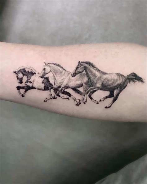 Three Running Horses Tattoo On The Arm