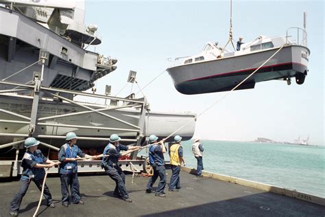 Us Navy Usn Boatswain S Mates Man The Guide Line As They Lower A 33